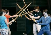 students swordfighting