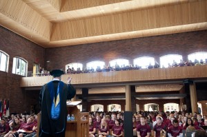 Crowd of incoming students listens to a speaker in Hoversten Chapel