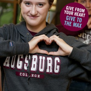 Auggie in an Augsburg sweatshirt. "Give from your heart. Give to the Max."