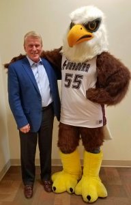 John Schwarts poses with Auggie Eagle