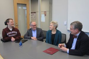 Sam '16, Hazen and Kathy Graves with President Pribbenow at their scholarship signing.