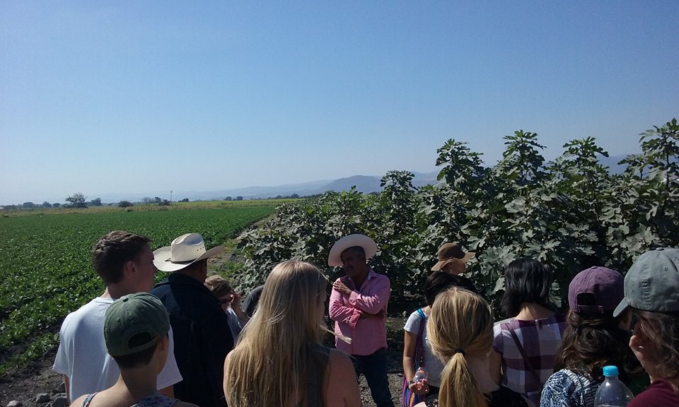 Students listen to a local farmer