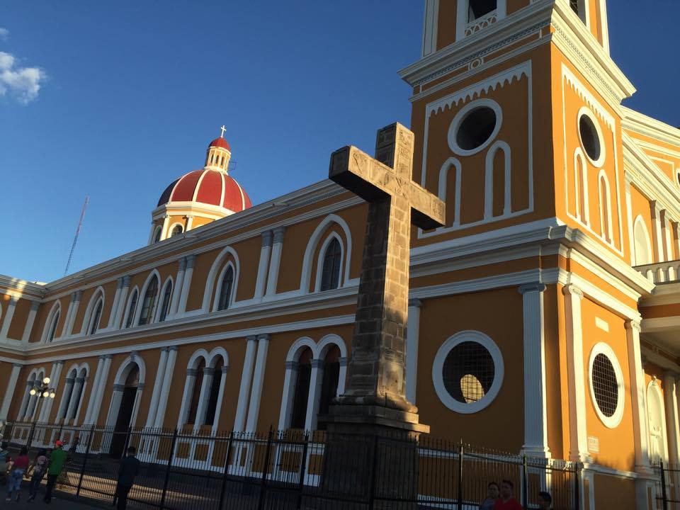 Red domed church with a cross