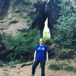 Student in front of rock formation