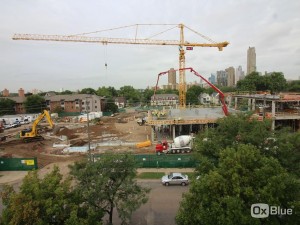 Construction crews completing the concrete pour for the second-story slab on the north wing of the Hagfors Center