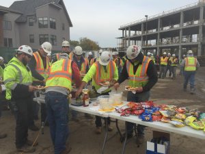 Construction crews take a break for an on-site lunch to celebrate 100 days of safety on the project