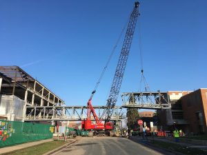 The third section of the skyway is lifted into place over 21st Avenue South