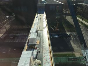 Piles of insulation rest on the top of the skyway, awaiting installation.