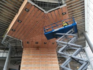 Frame of two-story lobby wall .