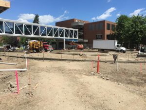 Crews continue work on the inner- and outer-ring curbs of the rotunda at the intersection of 21st Avenue South and South 7th Street.