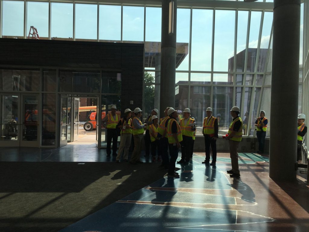 Members of the National Association of College and University Business Officers tour the Hagfors Center