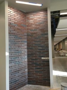 Nearly completed wall of donor bricks