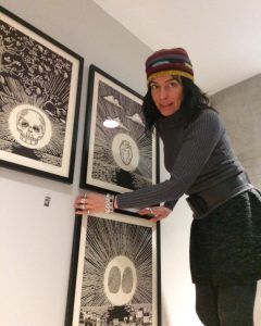 Tina Tavera hangs the third of six pieces of her art installation
