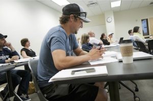 MBA student in an Augsburg University classroom