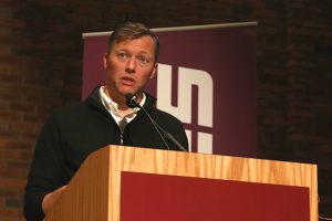 Matthew Desmond speaking at Augsburg University