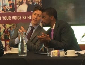 Mayors Jacob Frey and Melvin Carter at the debate discuss the finer points of civil debate.