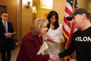 First Lady Gwen Walz greeted Randy Anderson, a board member with the Minnesota Second Chance Coalition.