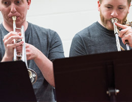  Steve Herzog ’06 [pictured, right] was selected by Bob Stacke ’71 to write and arrange the music for Midnimo visiting artists. Herzog often has needed to transcribe and arrange music in less than a week. Through this work, Herzog has been inspired to develop a program for engaging Somali youth in the advancement of Somali music. He’s also pursuing a master’s degree in education at Augsburg.