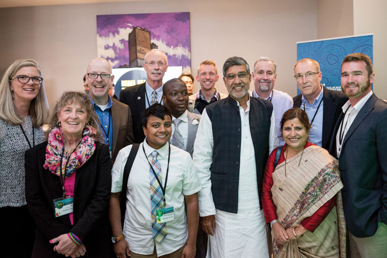 [L to R]: Jacqueline deVries; Margaret PowellMack ’17 MAL; Kevin Stirtz ’17 MAL; Subashini Ambrose ’18 MAL; Tom Morgan; Eric Miamen ’04, ’14 MBA, ’16 MAL; David Nyssen ’16 MBA, ’17 MAL; Nobel Laureate Kailash Satyarthi; Howie Smith ’80, ’19 MAL; Satyarthi’s wife, Sumedha Kailash; MAL Director Alan Tuchtenhagen; and Brad Beeskow ’17 MAL.