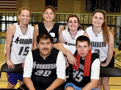 Athletes take a break from the action during a MIAC conference-wide unified basketball tournament held in April at Macalester College.