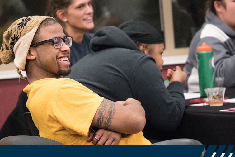 Chuckie Smith ’17listens at the workshop on financial planning.