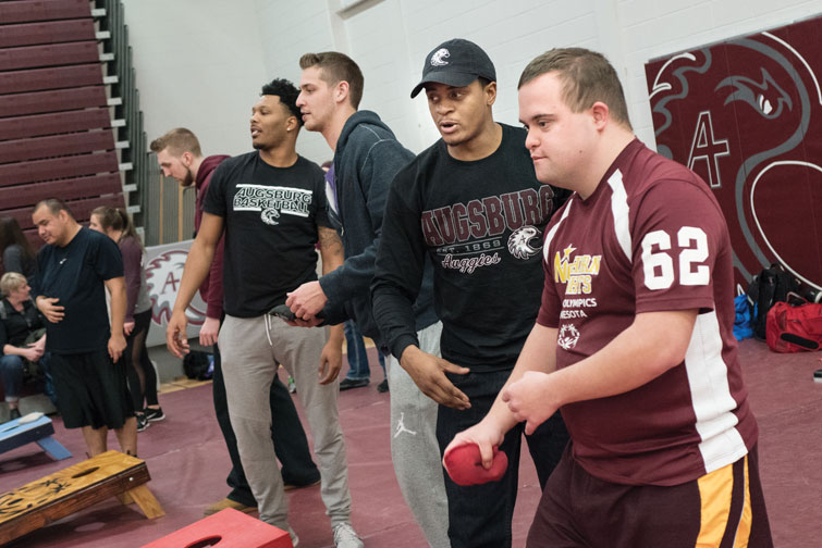 Augsburg student-athletes play basketball and bean bag competitions with Special Olympics athletes