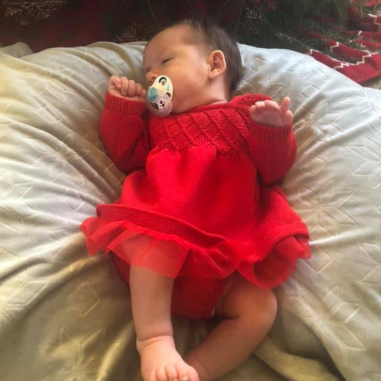 Baby grindal in a red dress