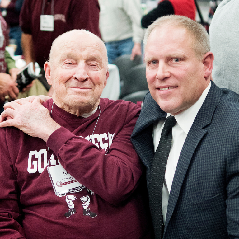 John Grygelko and Jeff Swenson pose for a photo at anniversary celebration