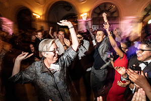 Provost Karen Kaivola and students dance to live music.
