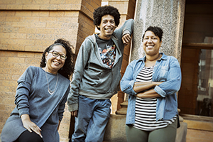 Mary Taris ’04 with two of her children, Jermaine Taris and LaToya Taris-James, who both work with Strive Publishing.