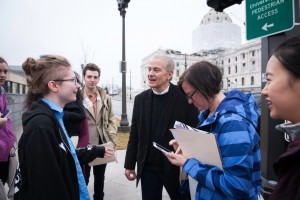 HECUA students learning in the field, near the state capitol in St. Paul.