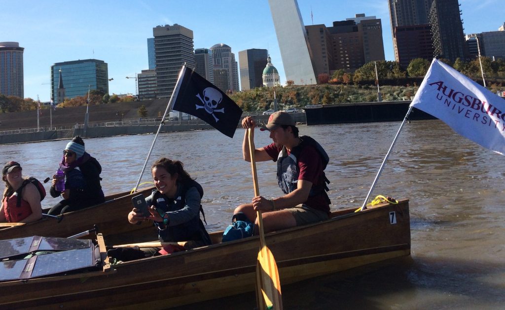 paddling in front of St. Louis arch