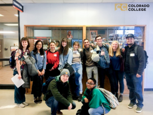 Students stand in a group photo.