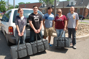 Campus Kitchen volunteers carrying food bags