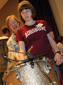 Roberta Kagin works with an Augsburg student