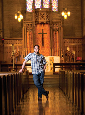 Michael Lansing stands in a sanctuary