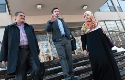 Ibrahim Al-Hajiby ’14, center, leaves Christensen Center with Nobel Peace Prize Laureate Tawakkol Karman, right, and Karman’s husband.