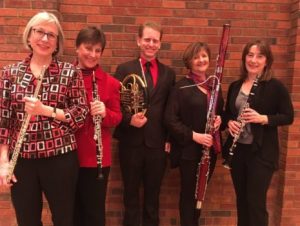 Five people with wind instruments