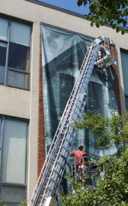 Banner hanging on side of building