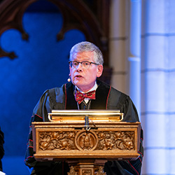 President Paul Pribbenow speaking behind a podium
