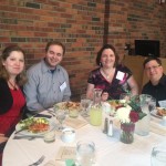 Guests seated around a table