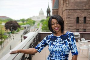 Danielle Stellner smiling on a roof in St. Paul