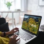 Laptop screen open iwht background of sunflowers