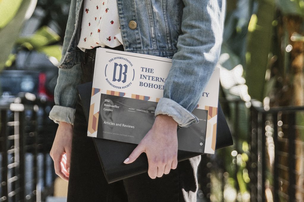 Person holding folder with created design