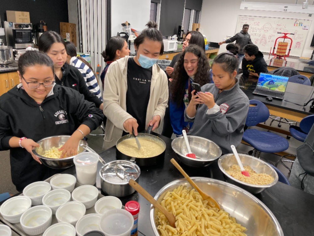 Students cook and talk in the Food Lab