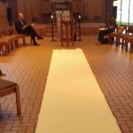 a large strip of paper down the middle of the chapel