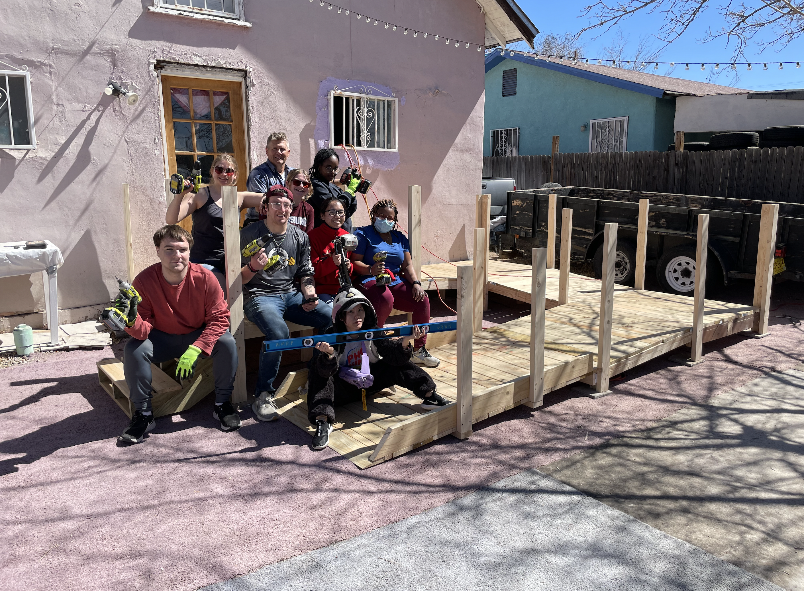 Students sitting with tools on newly built ramp.