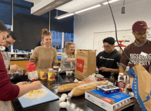 Students work in a classroom to prepare tacos for Wednesday Evening Dinner Church.