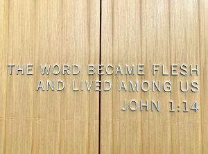 Wall with the words "The word became flesh and lived among us. John 1:14" on it