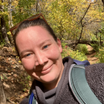 Selfie of Amanda hiking in the fall. 